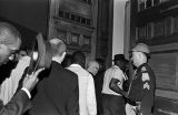 A group of African American men entering the Capitol in Montgomery, Alabama, probably attempting to deliver a petition to George Wallace at the conclusion of the Selma to Montgomery March.