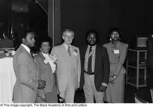 Photograph of an unidentified group of people posing with Jack Evans