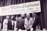 Walter Mosley and other panelists posing for photographs