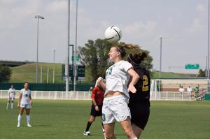 Danielle Herron headbutting the ball