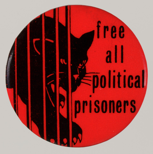 Pinback button with "Free All Political Prisoners" slogan