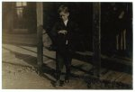 Accident to young cotton mill worker. Giles Edmund Newsom (Photo October 23rd, 1912) while working in Sanders Spinning Mill, Bessemer City, N.C. August 21st, 1912, a piece of the machine fell on to his foot mashing his toe. This caused him to fall on to a spinning machine and his hand went into the unprotected gearing, crushing and tearing out two fingers. He told the Attorney he was 11 years old when it happened. His parents are now trying to make him 13 years old. The school census taken at the time of the accident makes him12 years (parents' statement) and school records say the same. His school teacher thinks he is 12. His brother (see photo 3071) is not yet 11 years old. Both of the boys worked in the mill several months before the accident. His father, (R.L. Newsom) tried to compromise with the Company when he found the boy would receive the money and not the parents. The mother tried to blame the boys for getting jobs on their own hook, but she let them work several months. The aunt said "Now he's jes got to where he could be of some help to his ma an' then this happens and he can't never work no more like he oughter."  Location: Bessemer City, North Carolina.