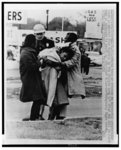 State trooper watches as apparently unconcious woman is removed from highway by two friends here 3/7 [ie March 7] after she fell in first rush of troopers to break up attempted Selma-to-Montgomery Negro march