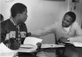 Two students converse while studying, circa 1985