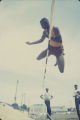 High jumper performing during the annual high school track meet of the Alabama Interscholastic Athletic Association, probably held in Montgomery.