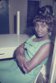 Woman seated behind a counter at the Laicos Club in Montgomery, Alabama.