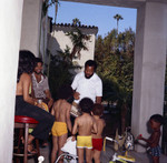 Berry Gordy with children at his house party, Los Angeles