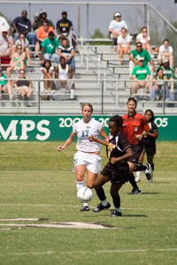 Katy Booth chasing the soccer ball