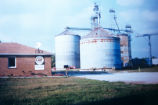 House and grain elevators (Lyles Station, Ind.)