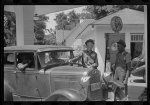 "Cherished customer." Negro buying gas, near Atlanta, Georgia