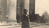 African American woman standing in front of the Carnegie Library on the campus of Tuskegee Institute in Tuskegee, Alabama.