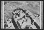 U.S. Negro troops on way to Liberia. The Naval armed guard on a Liberia bound transport stages a gun drill with a 4 inch deck gun and a heavy anti-aircraft machine gun. The Negro troops, members of a highly trained engineer unit of the U.S. Army, made the trip to Africa without incident