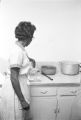 Waitress in the kitchen at Tom's Place at 648 South Holt Street in Montgomery, Alabama.