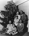 Family with Christmas tree