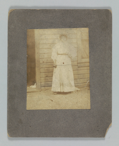 Photographic print of a woman in front of a building