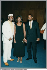 Photograph of Albert Lipscomb (left), a woman, and Joe Tave (right) posing for a photo