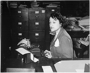 "Miss Clara Camille Carroll..., contributes her bit to the war effort in her daily work. She is one of the thousands of Negro girls now filling clerical positions in the Nation's Capital."