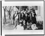 [Ten girls of the National Training School for Women and Girls, Washington, D.C., posed by stairs leading into building]