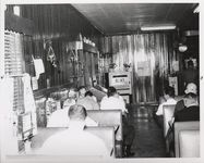 Mississippi State Sovereignty Commission photograph of men sitting and eating in booths inside Stanley's Cafe, Winona, Mississippi, 1961 November 1