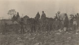 African American man and boy in a mule-drawn wagon in a rocky field in Lee County, Alabama.