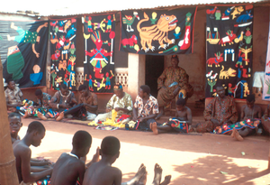 Appliqué workers, in street, Abomey, Benin