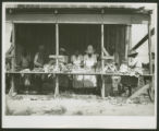 African-American women stringing tobacco