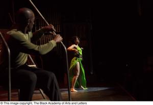 Performer in green dress dancing