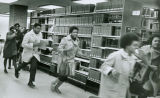 Students run through library