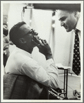 Miles Davis and George Avakian in recording studio, with John Coltrane in background