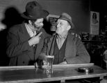 Two men, one African-American, socializing at a local bar, Seattle, ca. 1950's