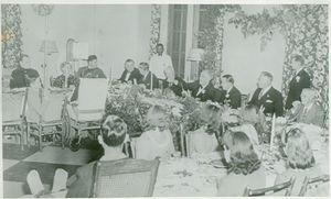 Photograph of Franklin Delano Roosevelt carving a turkey during a Thanksgiving celebration with Leighton McCarthy, Basil O'Connor, Cason Callaway, Cator Woolford, and Darwin Bussey at the Georgia Warm Springs Foundation, Warm Springs, Meriwether County, Georgia, 1930-1940?