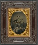 [Three unidentified soldiers in front of painted backdrop showing 34-star American flag]