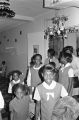 Children in the group "Buds of Promise" from Mt. Zion AME Zion Church in Montgomery, Alabama, walking through St. Jude Catholic Hospital in Montgomery, Alabama.