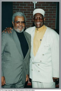 Photograph of Albert Lipscomb and a man posing for the camera