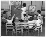 Louise John and Lucy Begay teaching children