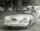 Burnis McCloud posing with convertible