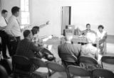 Richard Boone and Idessa Williams seated at a table in front of journalists during a press conference in Montgomery, Alabama.