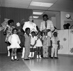 Children's fashion show participants posing together, Los Angeles, 1971