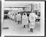 [A long line of African Americans picket outside Rich's Department Store, Atlanta, Georgia, in protest against segregated eating facilities at one of its lunch counters]