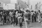 African American protestors in front of Klansmen at a United Klans of America march in Mobile, Alabama.