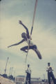 High jumper performing during the annual high school track meet of the Alabama Interscholastic Athletic Association, probably held in Montgomery.