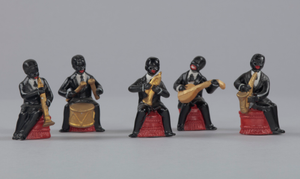 Five figurines in the form of caricatured male musicians