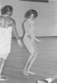 Viola Bradford learning a traditional African dance in a gymnasium, probably in Montgomery, Alabama..