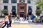 People walking in front of the Laborers Internation Union of North America building, located on Black Lives Matter Plaza at the Juneteenth 2020 Celebration