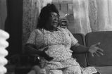 Fannie Bell Chapman: Centreville, Miss. Mrs. Chapman in house explaining healing with hands (FCP 15-72-7 #423)