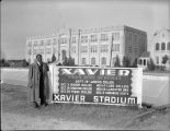 Ralph Metcalfe stands by Xavier University football schedule, 1936