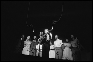 Bob Dylan leading performers on stage, Newport Folk Festival Left to right: Peter Yarrow, Mary Travers, Paul Stookey, Joan Baez, Bob Dylan, Bernice Reagon, Cordell Reagon, Charles Neblett, Rutha Harris, Pete Seeger