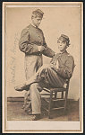 [First Lieutenant Waldo Flint Corbett of Co. H, 29th Massachusetts Infantry Regiment and 1st U.S. Colored Troops (USCT) Heavy Artillery Regiment and First Lieutenant George H. Root of Co. C, 1st U.S. Colored Troops Heavy Artillery Regiment in uniform with cigars]