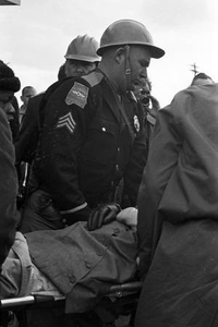 State troopers carrying an injured woman on a stretcher after the Bloody Sunday attach in Selma, Alabama.