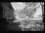 Old wooden shacks on left of picture inhabited by whites and Negroes. Many of these houses have no inside water supply or toilet. Washington, D.C.